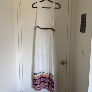 Pink Owl maxi dress, white with belt and multi-color pattern at bottom.
